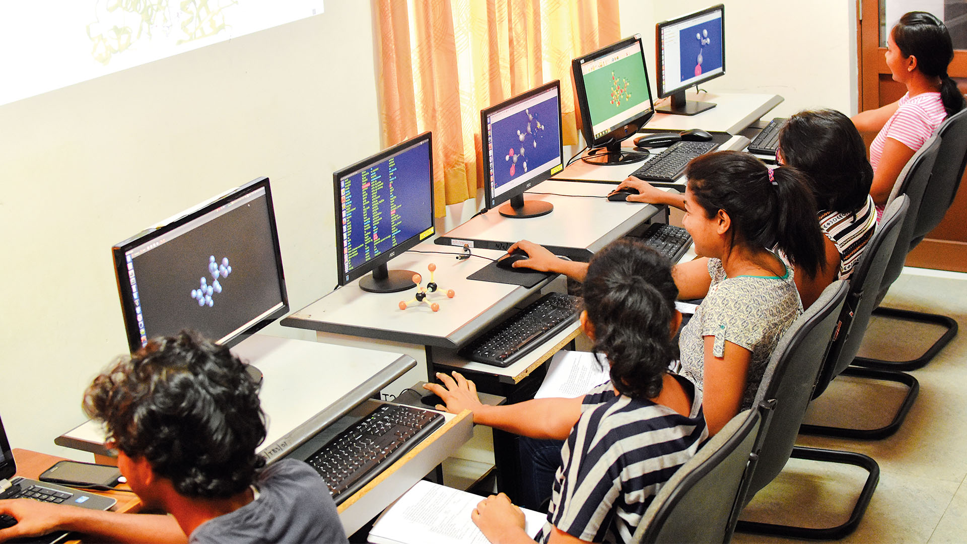 Students engaged in computational chemistry work at the Computational Research and Learning Center